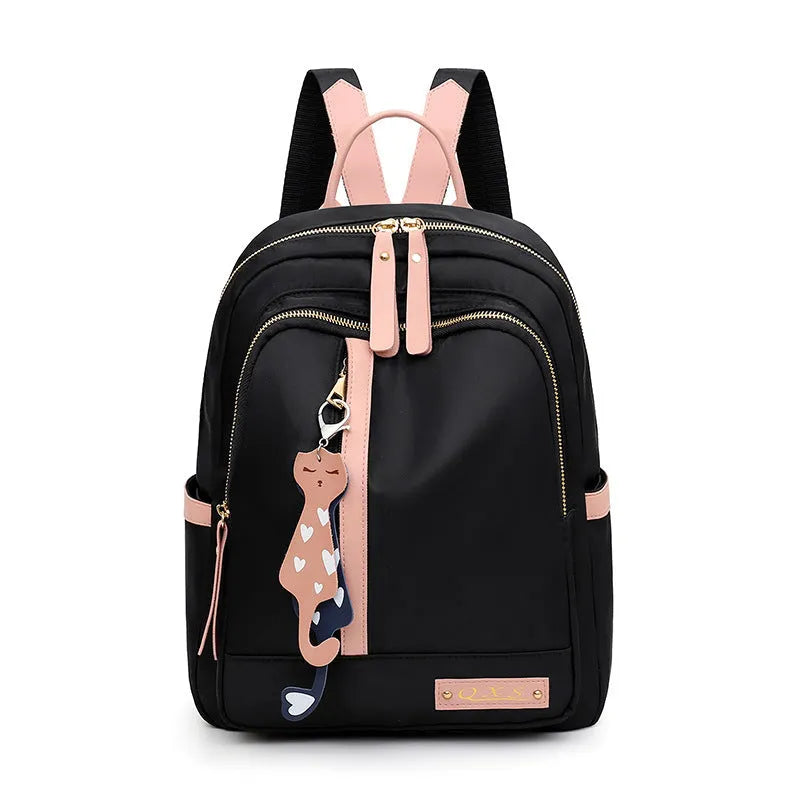Women's black nylon casual backpack with double shoulder straps showing internal compartments and waterproof features