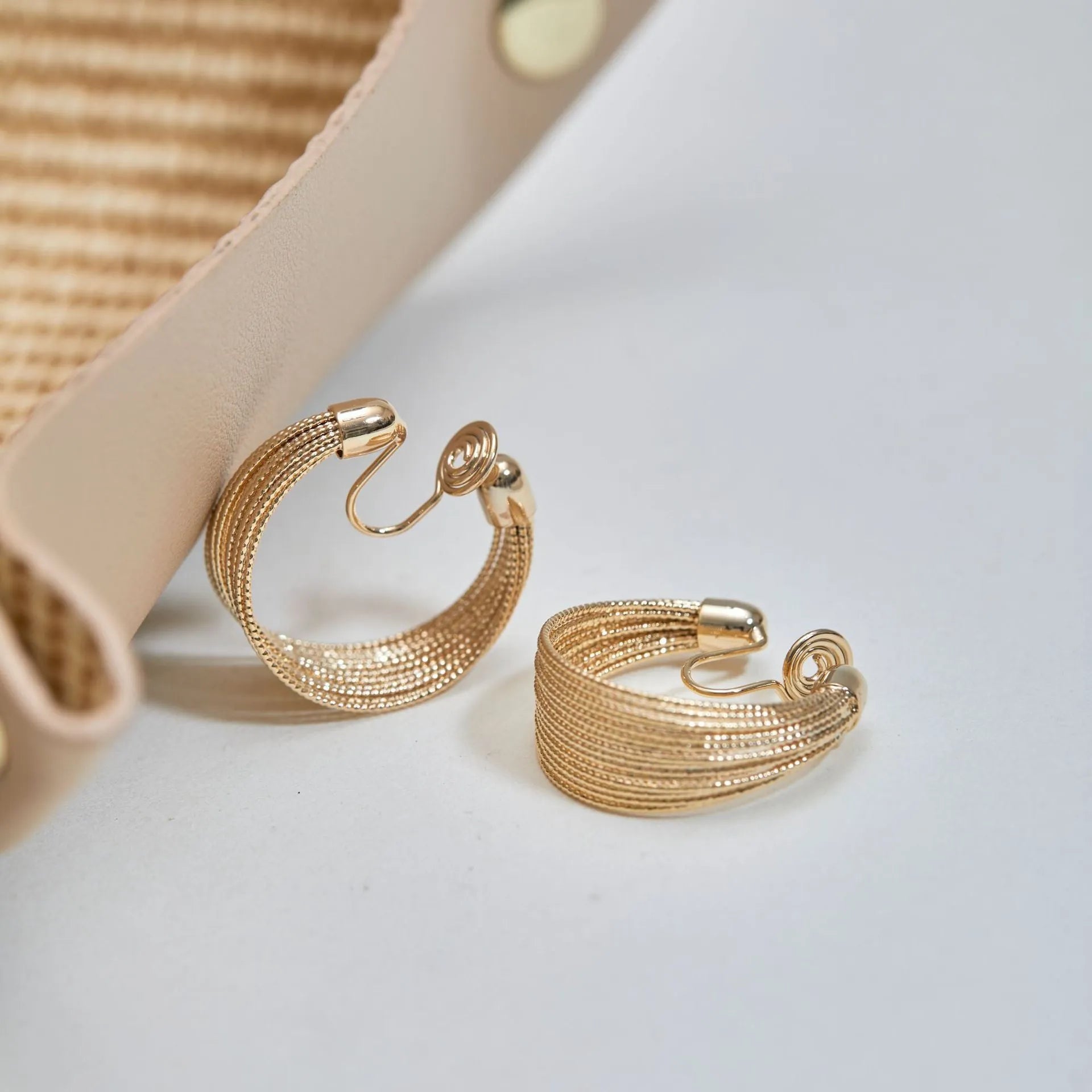 Multi-layer geometric bracelet earrings in gold and silver colour options as studs and clips