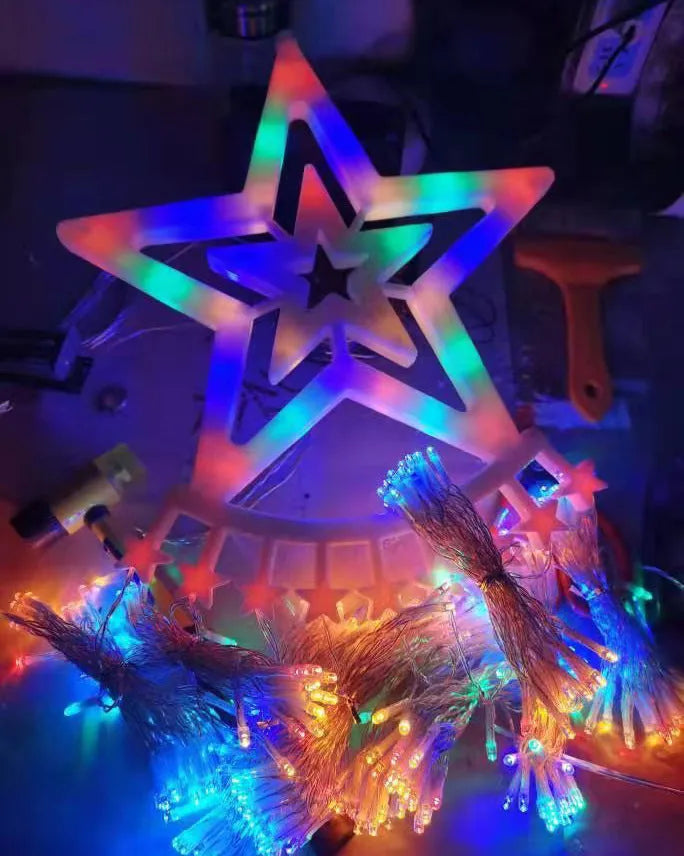 LED five-pointed star waterfall light for outdoor courtyard decoration, 1000mm length, warm white light, on a wooden fence