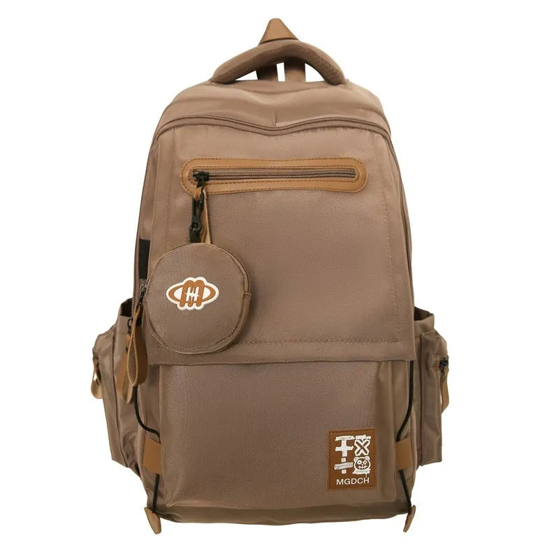 Large-capacity nylon school backpack for middle school students in solid colour with curved shoulder straps