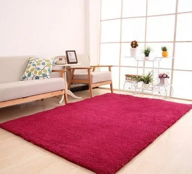 Solid colour plush area rug with non-slip dot-patterned bottom in rectangular shape