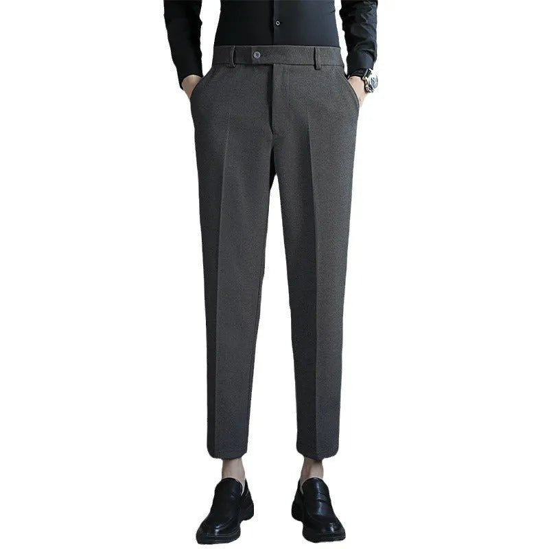 Men's straight leg brown corduroy trousers with an elasticated waistband on a hanger