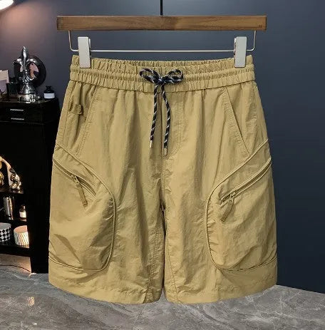 Man wearing loose fit camouflage cargo shorts made from quick-drying cotton blend fabric.