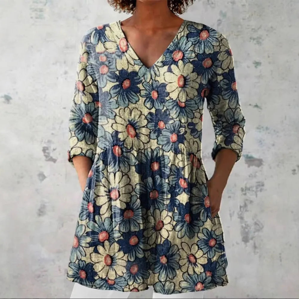 Woman wearing a retro slim fit, digitally printed long-sleeved top in a floral design.