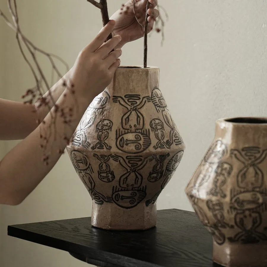 Hand-painted ceramic vase with vintage carved religious patterns in tribal totem colours