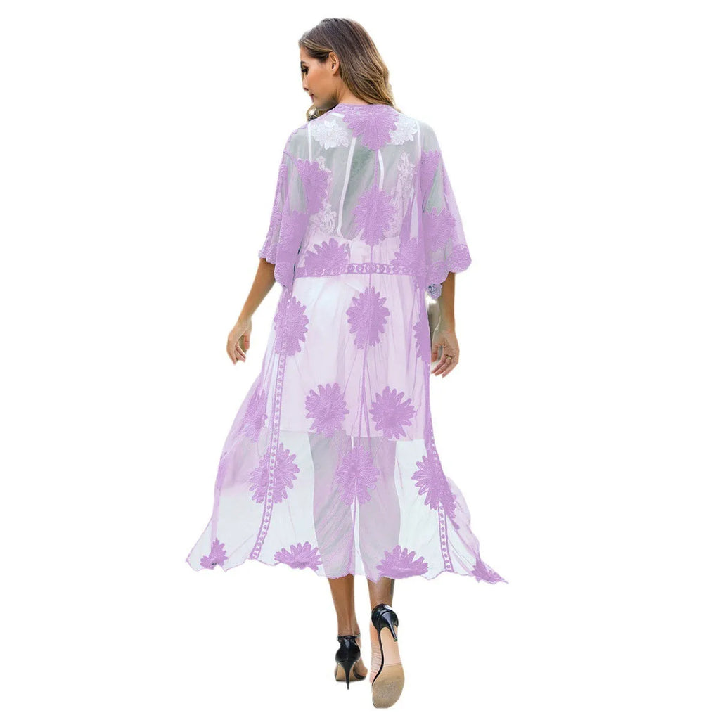 Light purple lace embroidered dress worn as a beach cover-up cardigan.