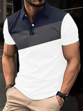 Man wearing a loose-fit grey T-shirt with a colourful abstract 3D digital print on the front.