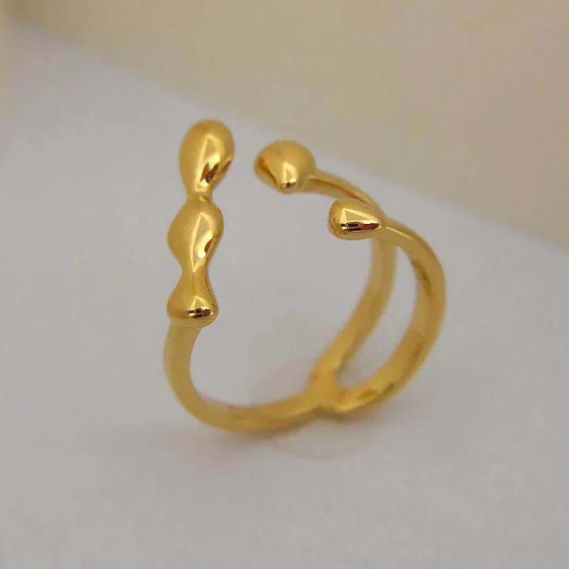 Adjustable brass opening ring with sphere design in gold colour for women