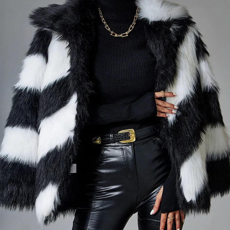 Faux fur coat with contrasting colour lapel and a attached fur collar.