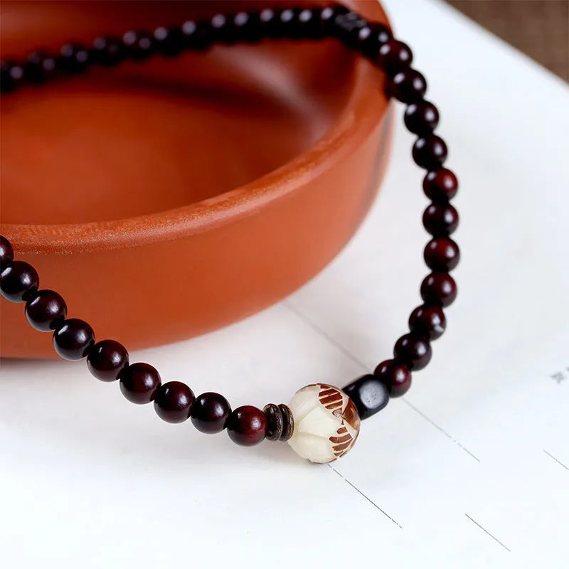 Natural rosewood double-ring bracelet with retro flower design, 10mm size, showing double circle pattern