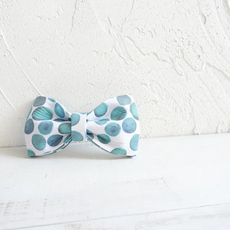 Polyester pet bow collar jewellery in bubble colour on a light background showing size options XS to XL