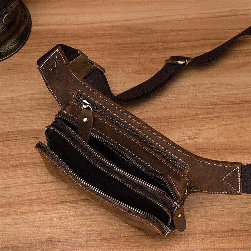 Brown cow leather sports waist bag with pull closure showing internal mobile phone pocket