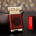 Ebony gas lighter with carved rosewood good luck design on a metal body.