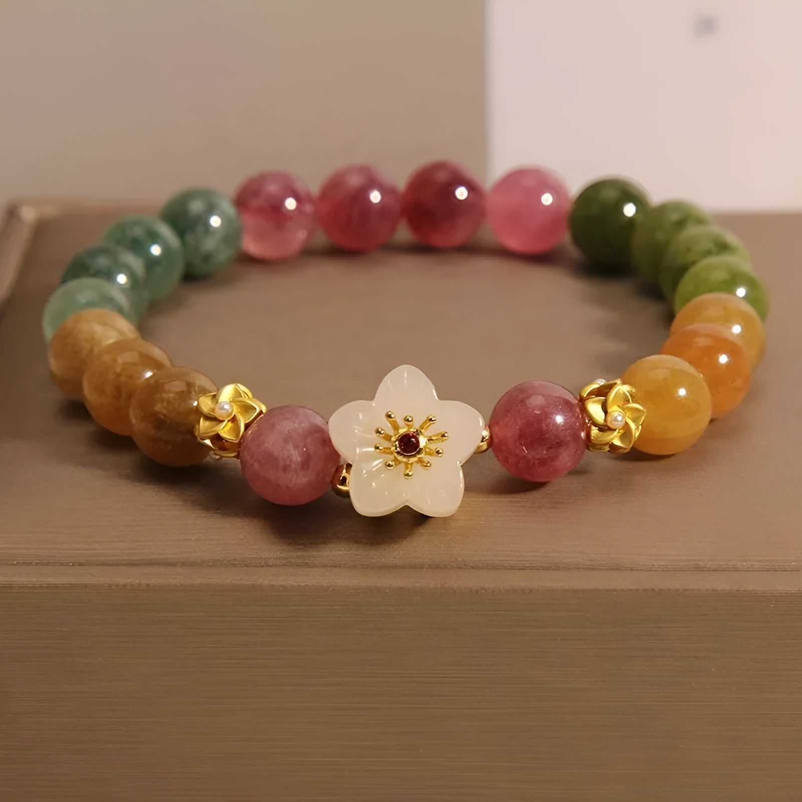 Natural colour tourmaline bracelet showing floral design option with electroplated silver finish