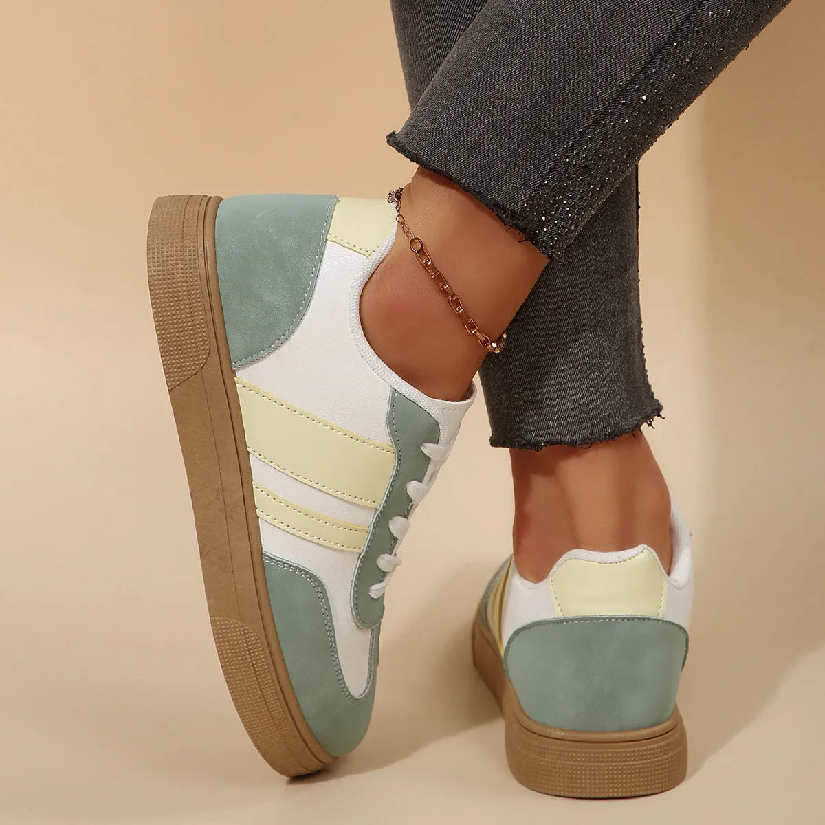 Green retro sports women's shoes with cross-strap design and low-top construction