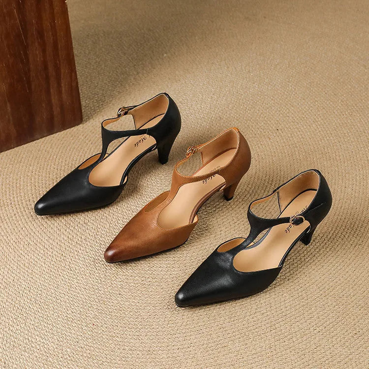 Brown retro women's T-strap sandals with a closed round toe, buckle fastening, and a chunky block heel.