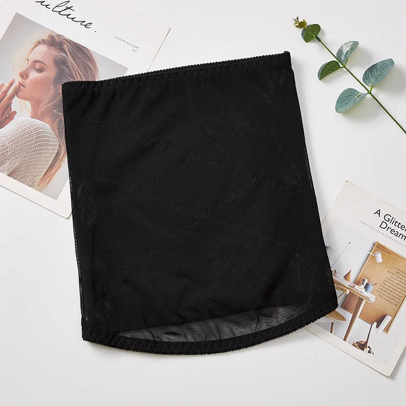 Mesh postpartum belly band in black with adjustable strap and cross waistband design