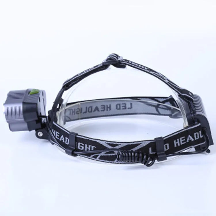 Head-mounted camping light with LED beam showing waterproof construction and rechargeable battery