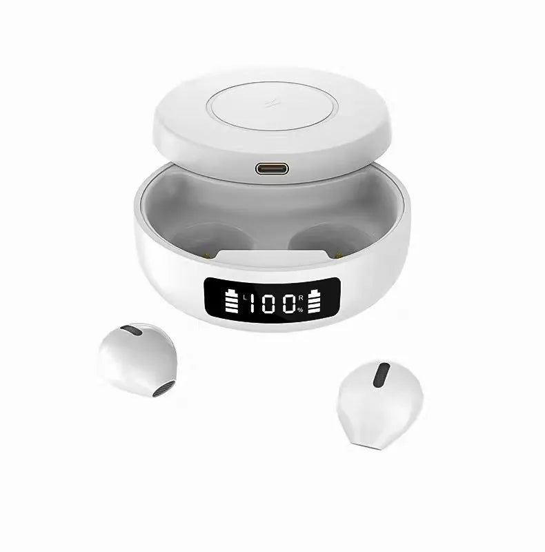Mini black semi-in-ear wireless headphones sitting inside their white wireless charging case.