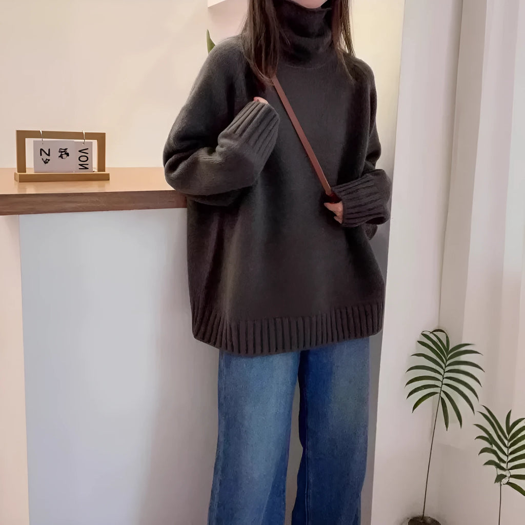 Red loose-fit women's turtleneck sweater with thick knit and a textured curling collar.