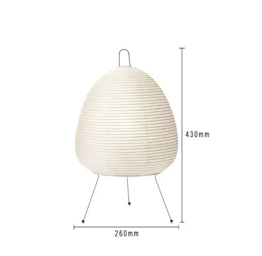 Handmade Nordic-style table lamp with a Japanese rice paper shade and aluminium base on a wooden table