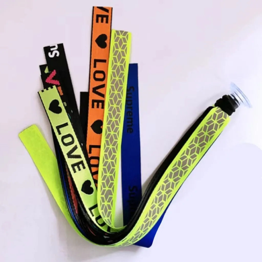 Close-up of a colourful decorative ribbon streamer attached to a child's helmet for roller skating or skiing.