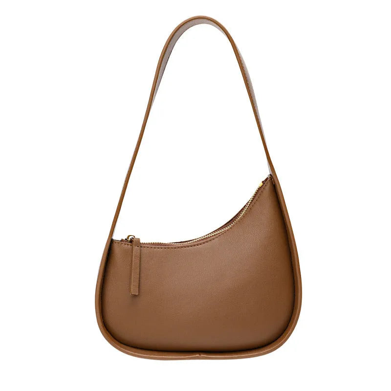 Small half moon shaped leather shoulder bag with wide strap in four colour options