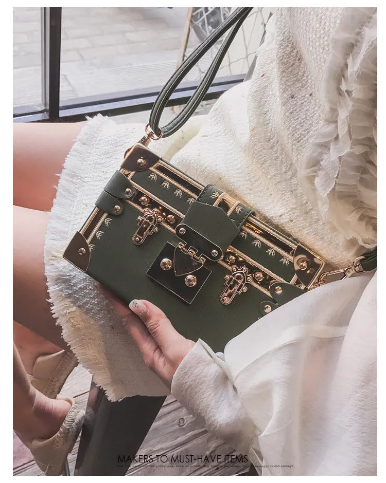 Hard-case women's shoulder bag with flap design, rivet decoration, and adjustable crossbody strap