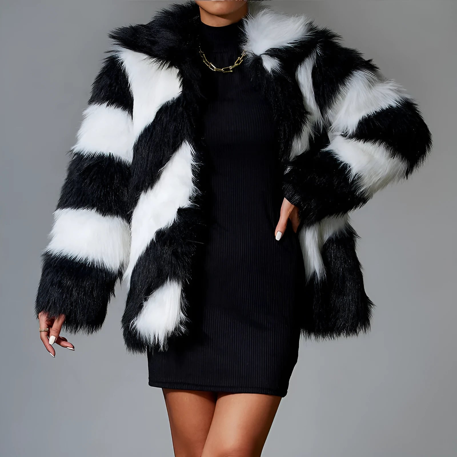 Faux fur coat with contrasting colour lapel and a attached fur collar.