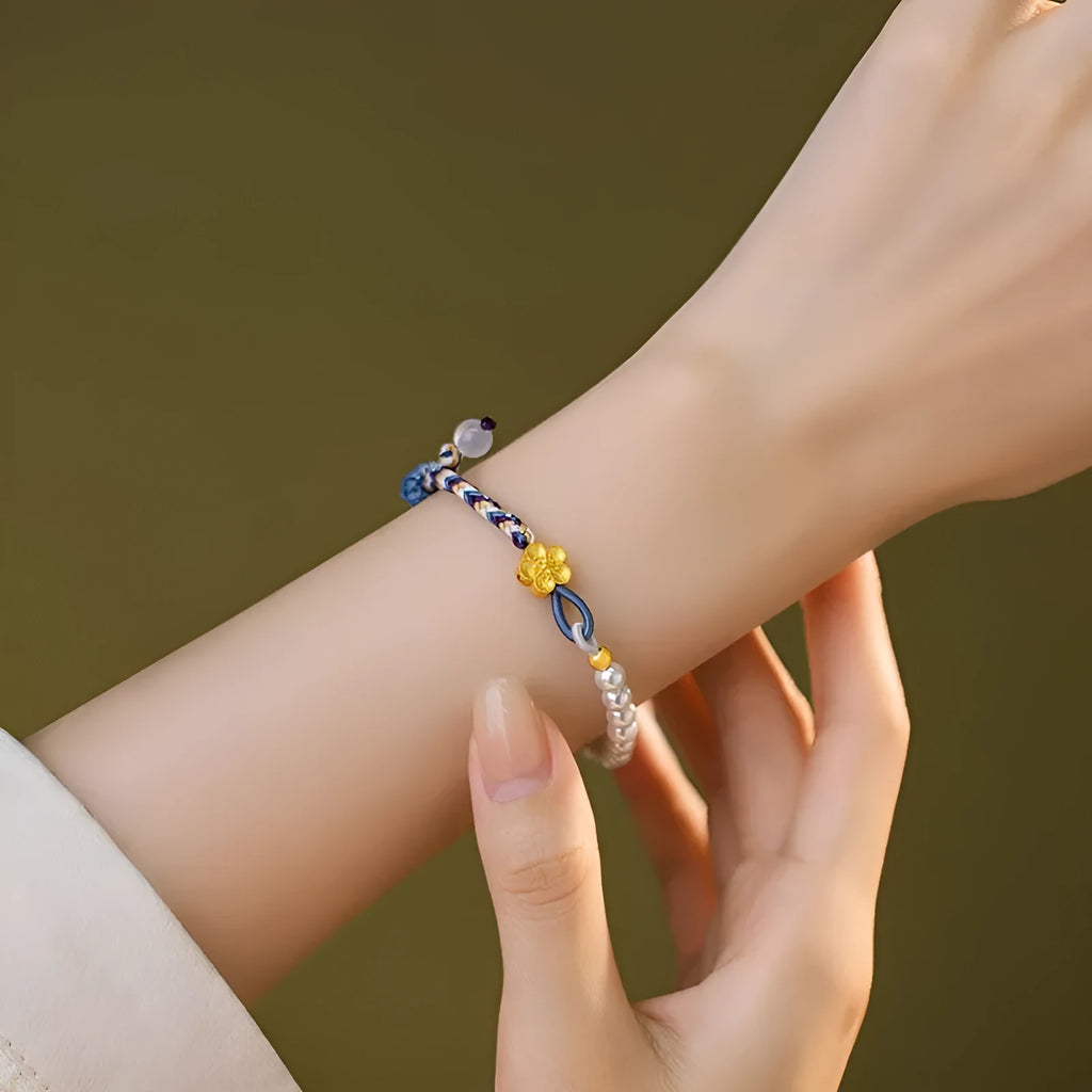 Colourful carrying strap bracelet with Chinese flower weaving and pearls in peach colour