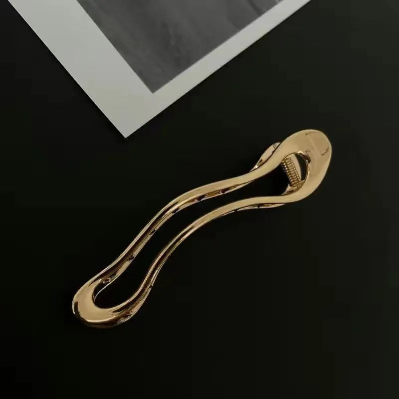 Women's zinc alloy hair barrettes in gold and silver square, arc and triangle shapes