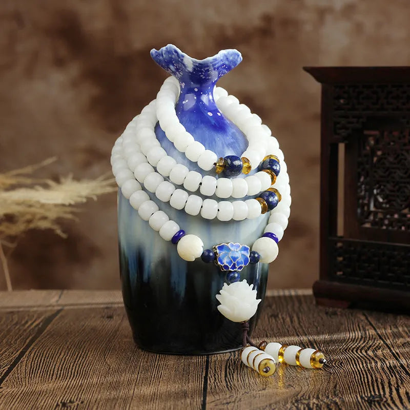 White jade Bodhi seed bracelet with 6x8mm beads showing multiple decorative style options