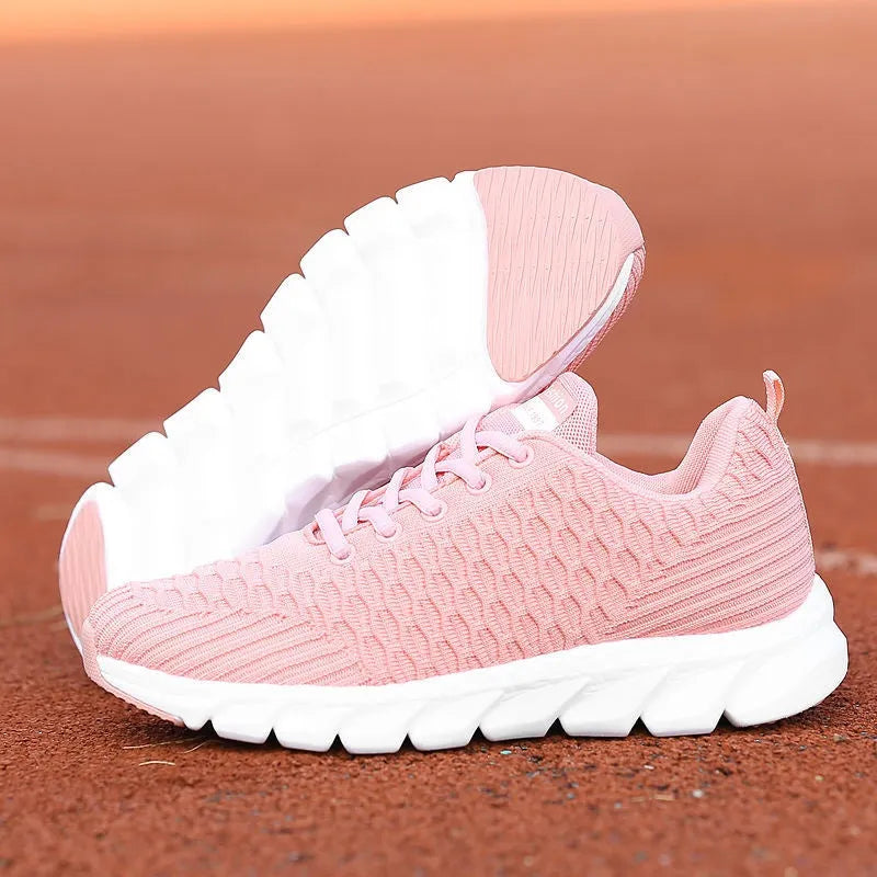 Women's running shoes in black pink white colours with fly weaving upper and wear-resistant outsole