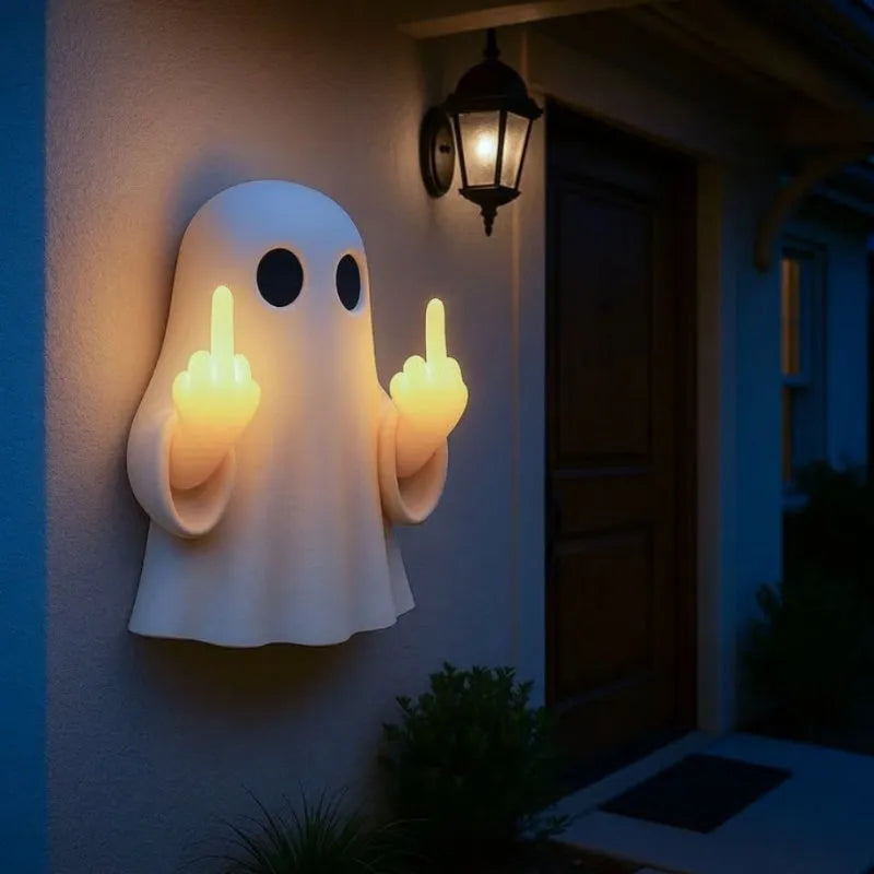 White ghost statue Halloween night lamp with LED lighting on black background