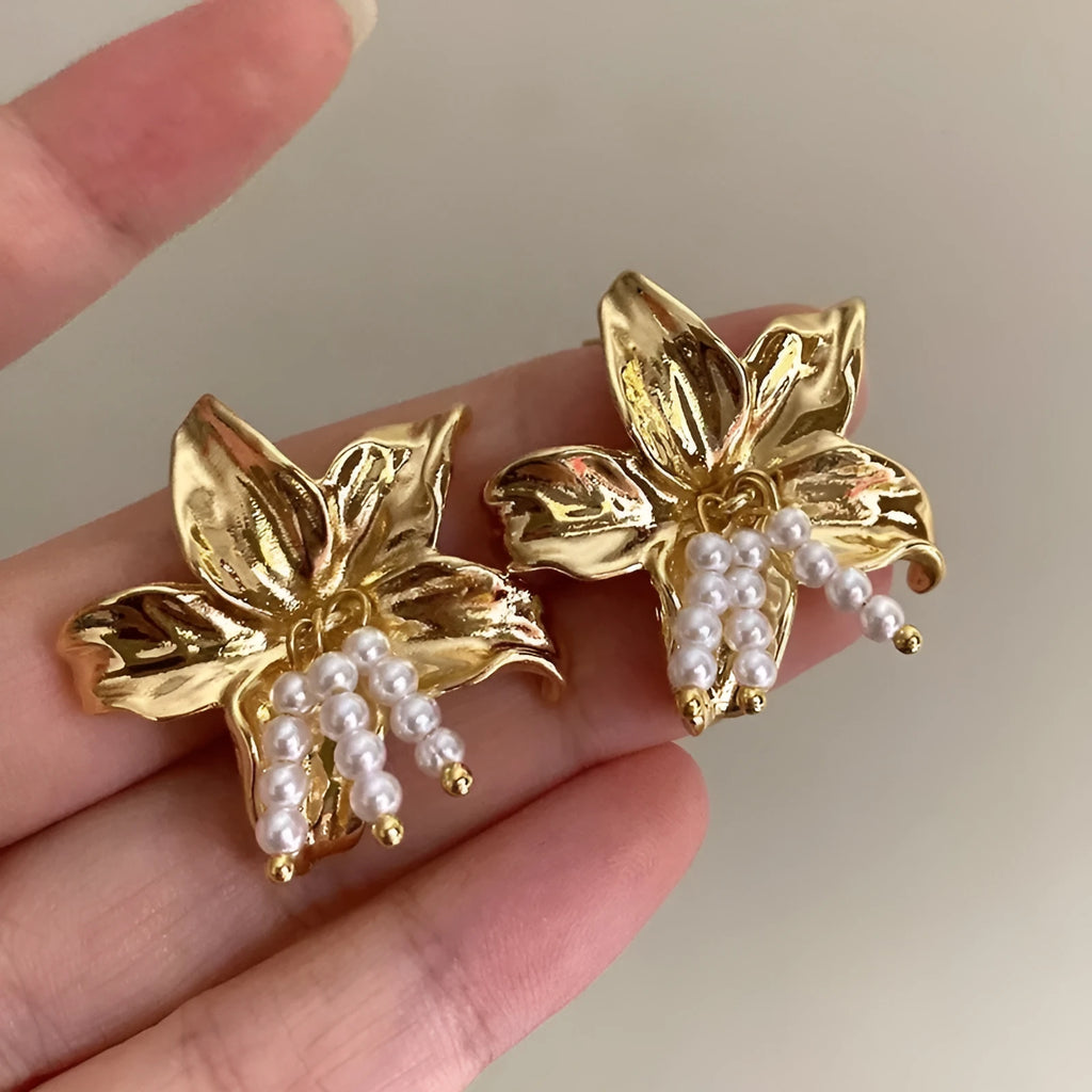 Gold H1795 pearl flower earrings with exaggerated floral design and Seiko-treated metal construction