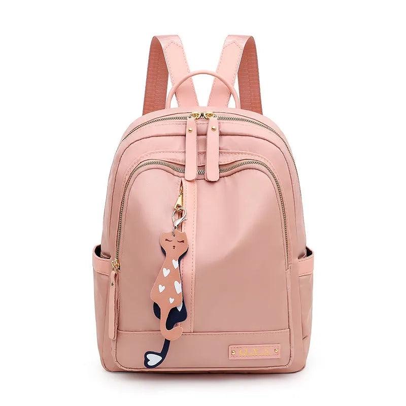 Women's black nylon casual backpack with double shoulder straps showing internal compartments and waterproof features
