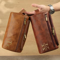 Men's neutral-coloured PU travel organiser with multiple compartments open showing interior layout
