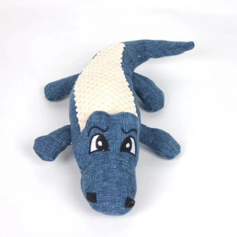 Blue corn-shaped plush dog toy with grid texture on a white background.