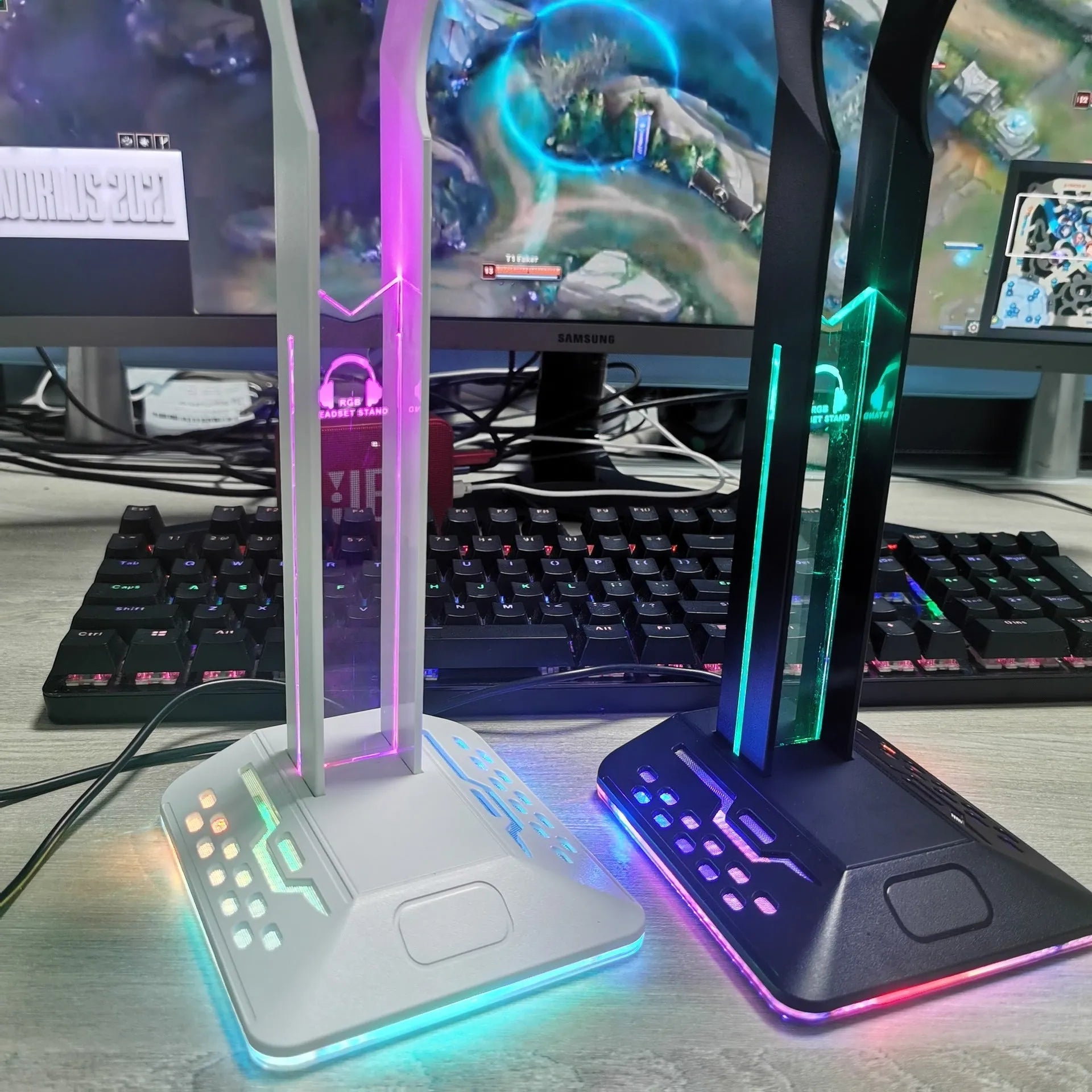 RGB colour-changing headphone display bracket with integrated dual USB ports on a desk.