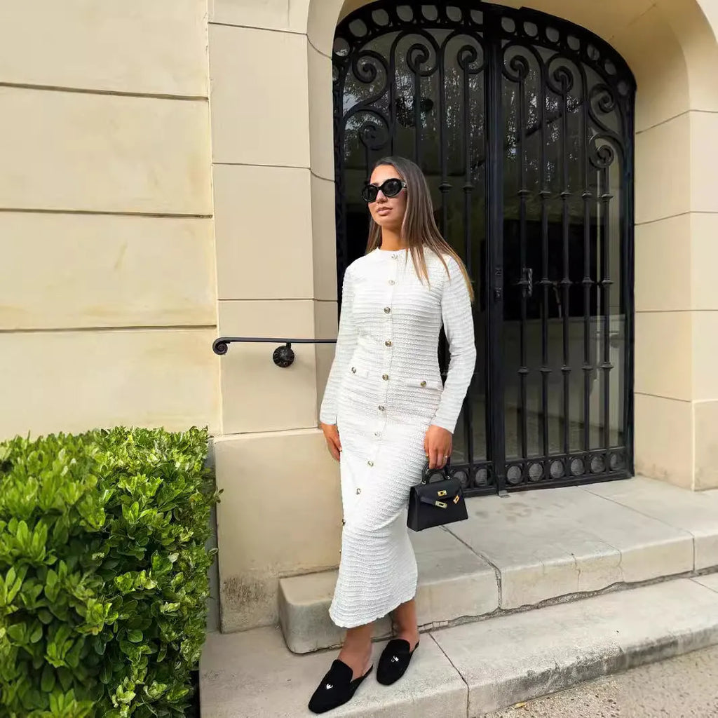 French retro slim fit knitted long-sleeved dress with button front in black or white.