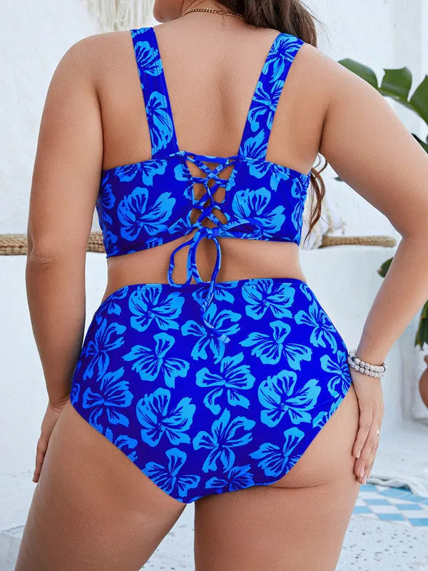 Blue floral print women's plus size bikini top and briefs on a mannequin, showing the split style and pattern detail.