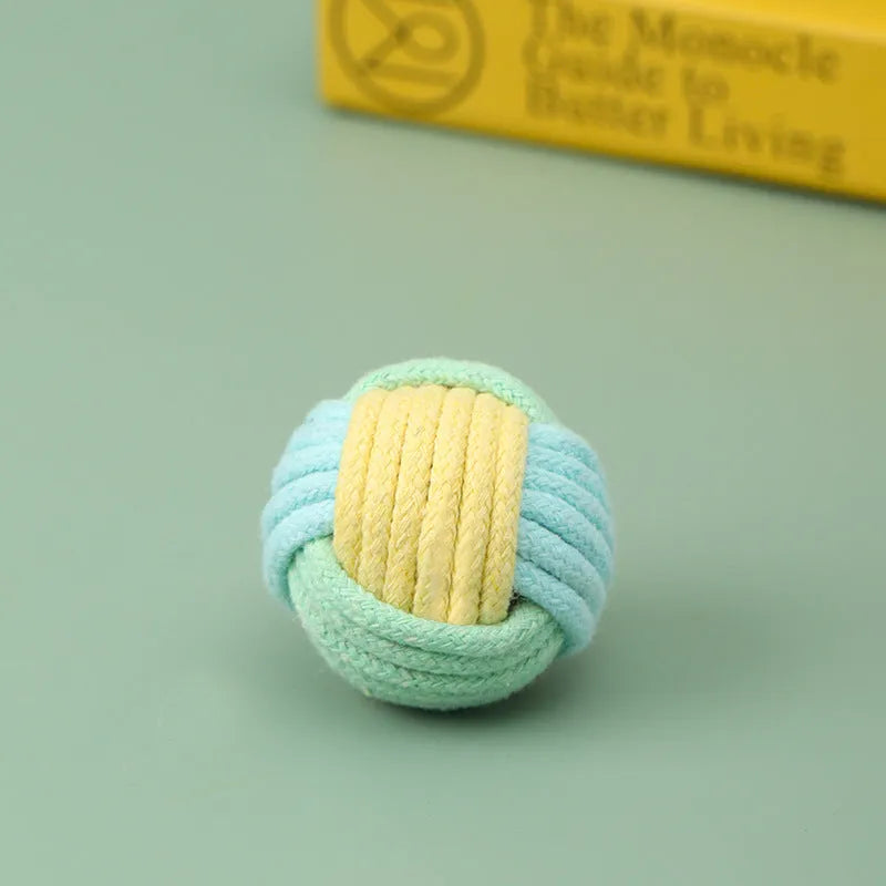 Handmade blue powder and green cat hair ball plush cotton toy for pet teeth grinding.