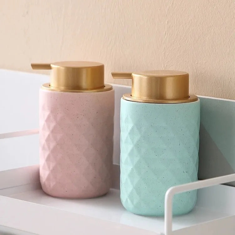 A large-headed foam pump for soap in a metallic gold finish, made from ABS plastic.