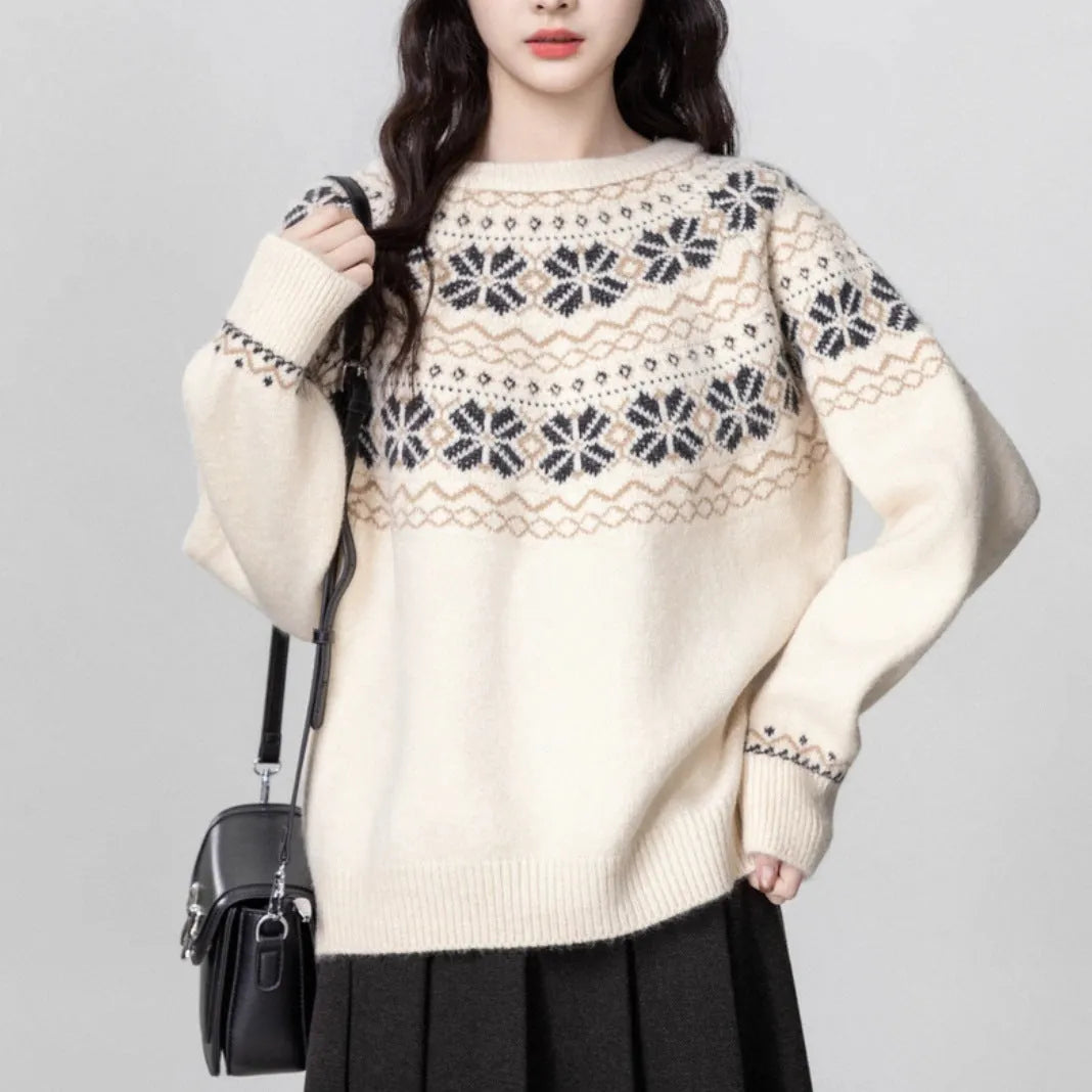 Women's loose-fit Fair Isle pullover sweater with white geometric knit pattern, crew neck, and long sleeves.