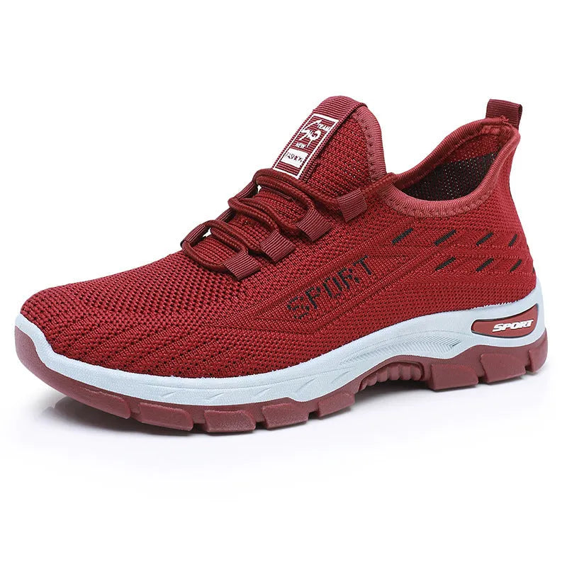 Men's and women's casual low-top sneakers with a soft PVC sole in black, red, light purple, grey, and brown.