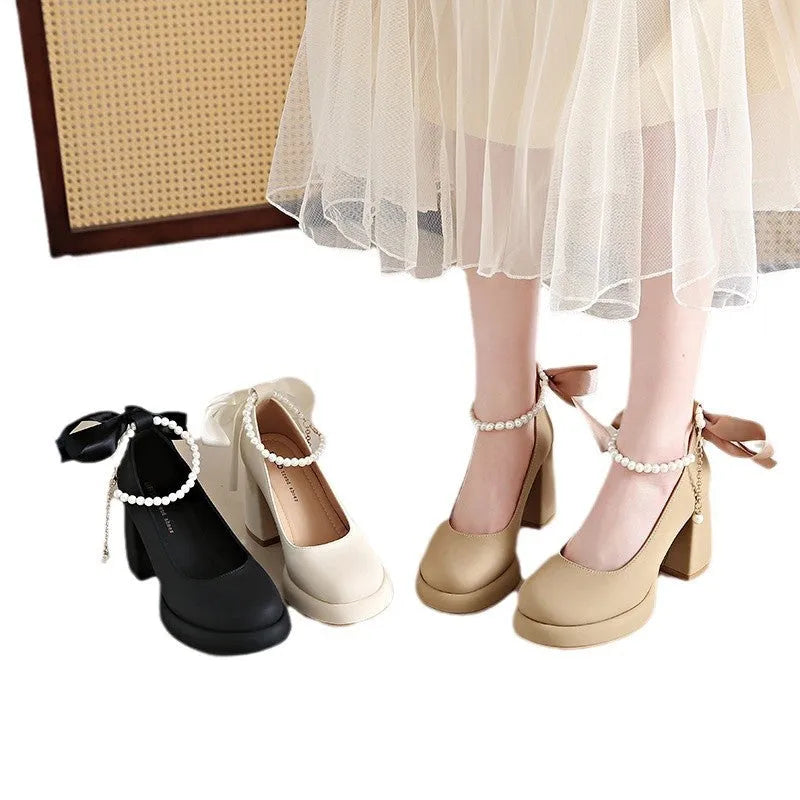 Women's beige Mary Jane shoes with chunky heel and ankle-strap buckle on a white background