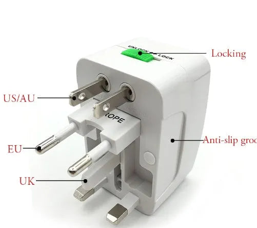 A compact white universal travel plug converter on a plain background.