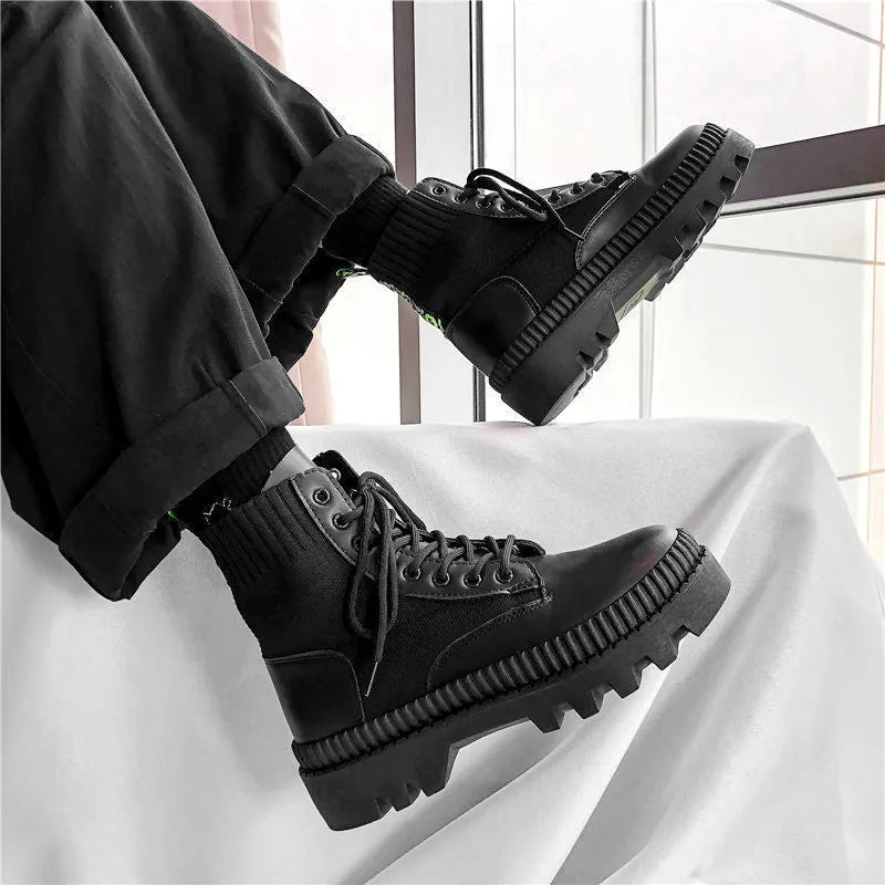 Black platform Dr. Martens boots with front zipper and frosted leather finish