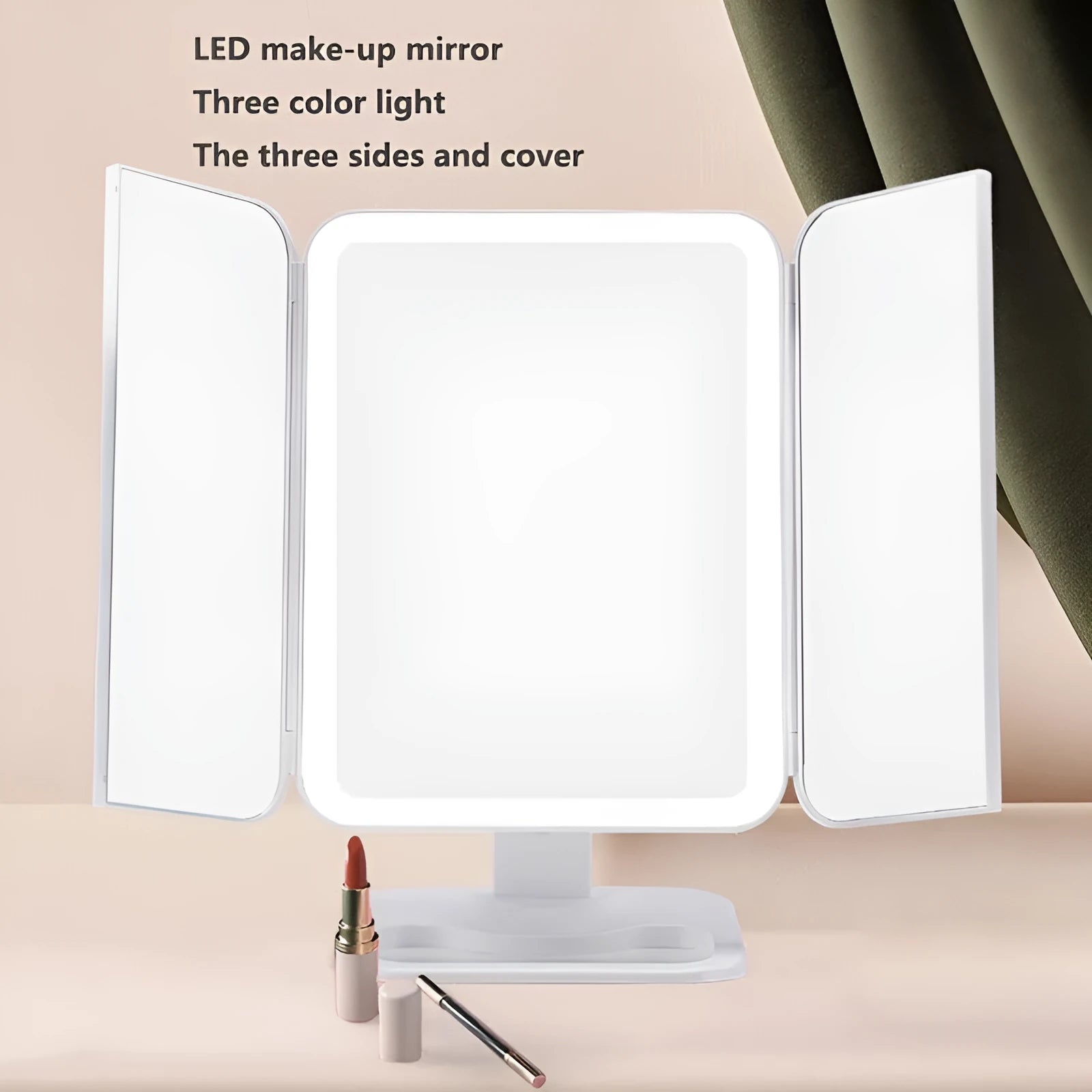 Trifold LED makeup mirror with 68 lights, 10X magnifying mirror, and USB rechargeable battery on table