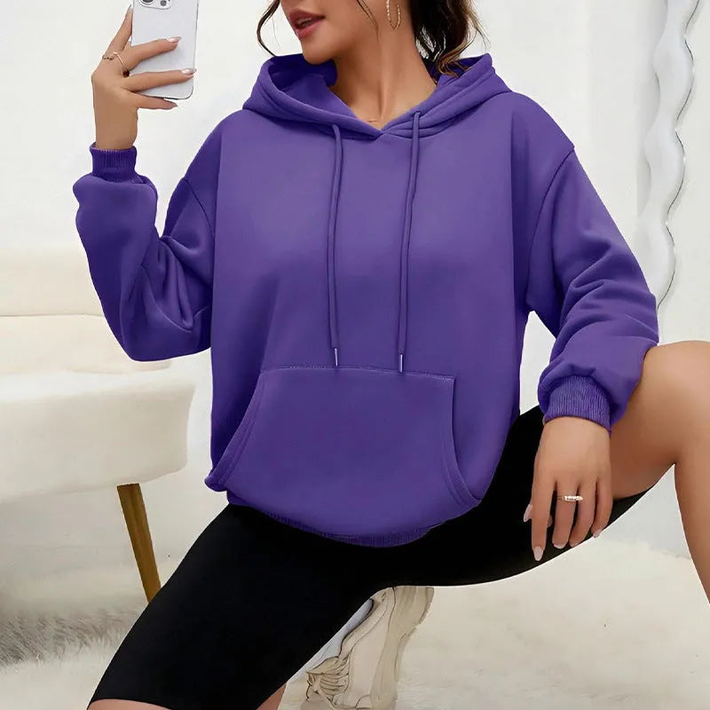 Women's loose fit grey drawstring hood sweatshirt with front pockets, long sleeves